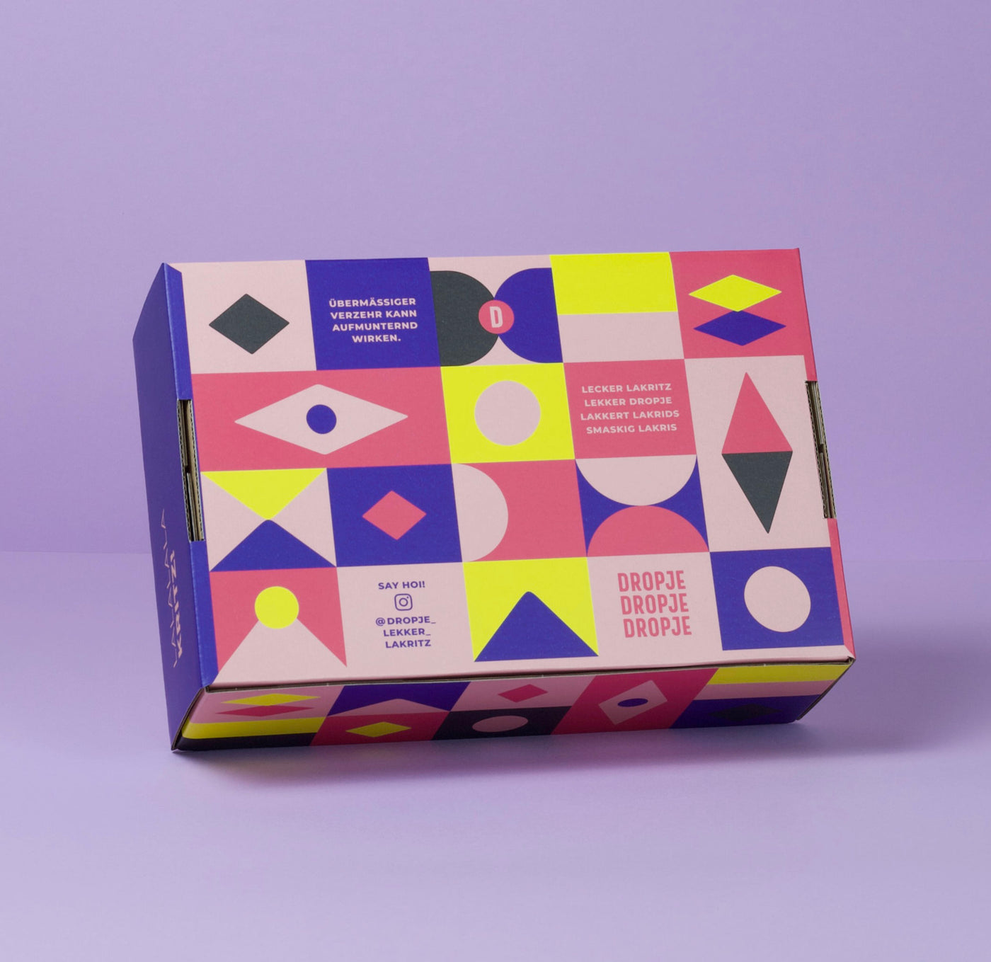 Stylische DROPJE Lakritzbox – Geschenkverpackung mit Mustern, die Lakritzsorten symbolisieren